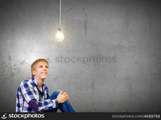 Thoughtful guy. Young handsome man in casual thinking over something