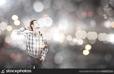 Thoughtful guy. Young handsome man in casual thinking over something