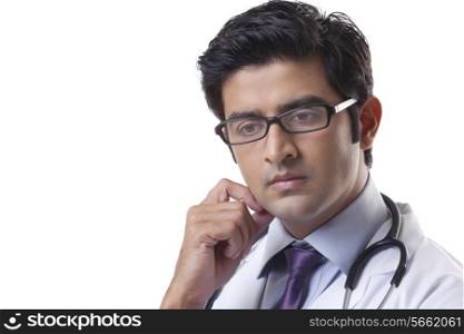 Thoughtful male doctor over white background