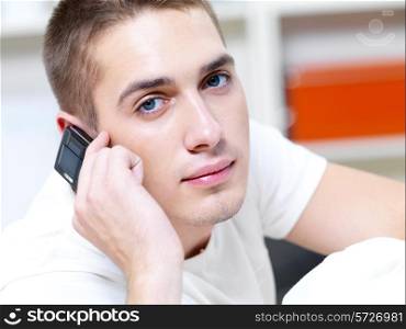 thoughtful man call in the phone on white background
