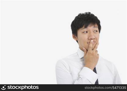 Thoughtful mid adult businessman over white background