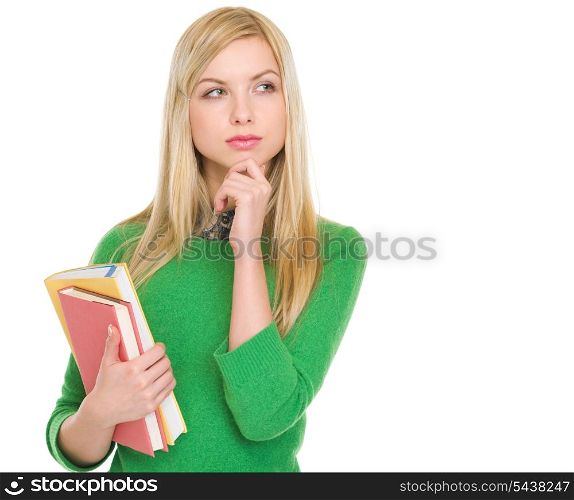 Thoughtful student girl with books looking on copy space