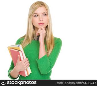 Thoughtful student girl with books looking on copy space
