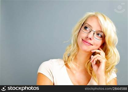 Thoughtful woman wearing glasses