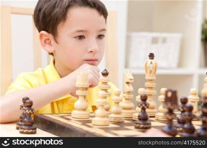 Thoughtful Young Boy Playing Chess