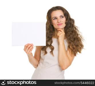 Thoughtful young woman holding blank paper