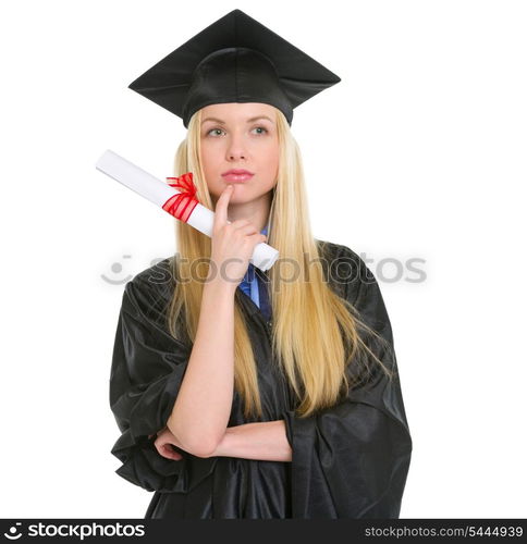 Thoughtful young woman in graduation gown with diploma