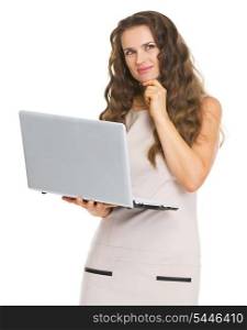 Thoughtful young woman with laptop