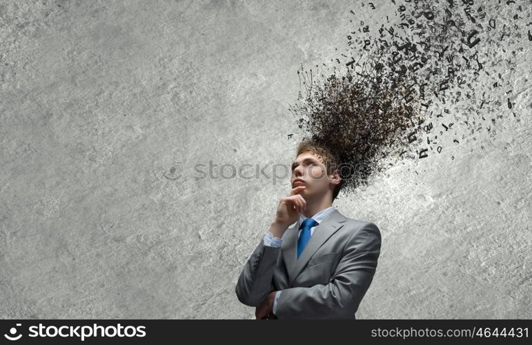 Thoughts in head. Young thoughtful businessman and thoughts above his head