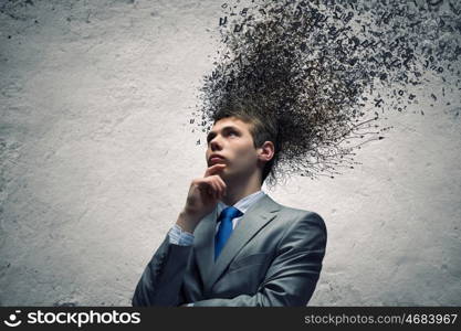 Thoughts in head. Young thoughtful businessman and thoughts above his head