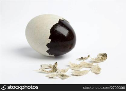 Thousand years duck egg with partial peeled egg-shell