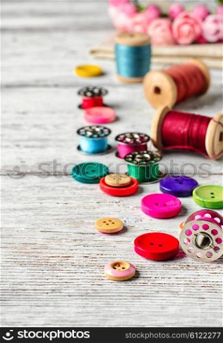 Thread and buttons with beads sewing and needlework. Buttons and spool of thread