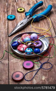 thread,beads and tools for needlework vintage background