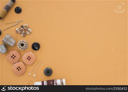 thread buttons needle thimble colored backdrop