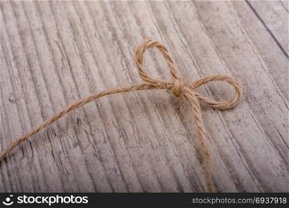 Thread tied as knot on a light color background