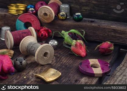 Threads,beads and accessories for needlework in wooden box old