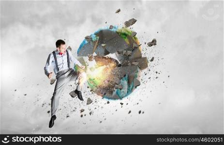 Threat of ecological catastrophe. Man in anger crashing earth planet. Elements of this image are furnished by NASA