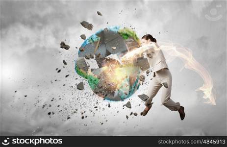 Threat of ecological catastrophe. Woman in anger crashing earth planet. Elements of this image are furnished by NASA