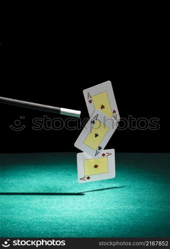 three aces playing card air done with magic wand green background