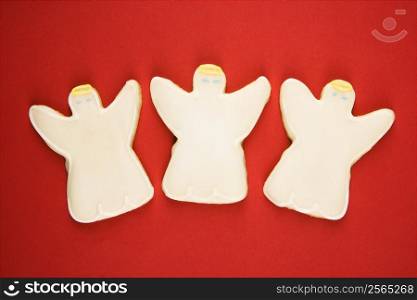 Three angel sugar cookies with decorative icing.