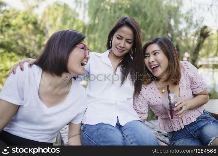 three asian woman laughing with happiness emotion