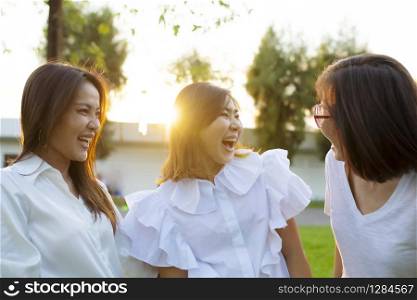 three asian woman relaxation outdoor with happiness face