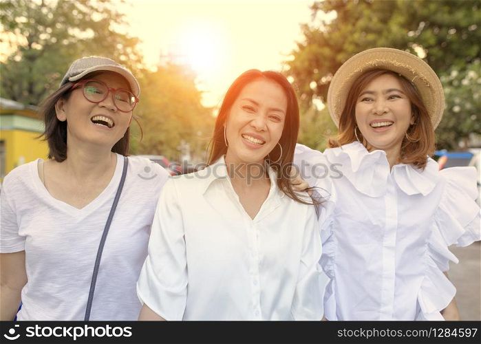 three asian woman relaxation outdoor with happiness face