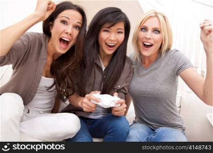 Three Beautiful Women Friends Playing Video Games at Home
