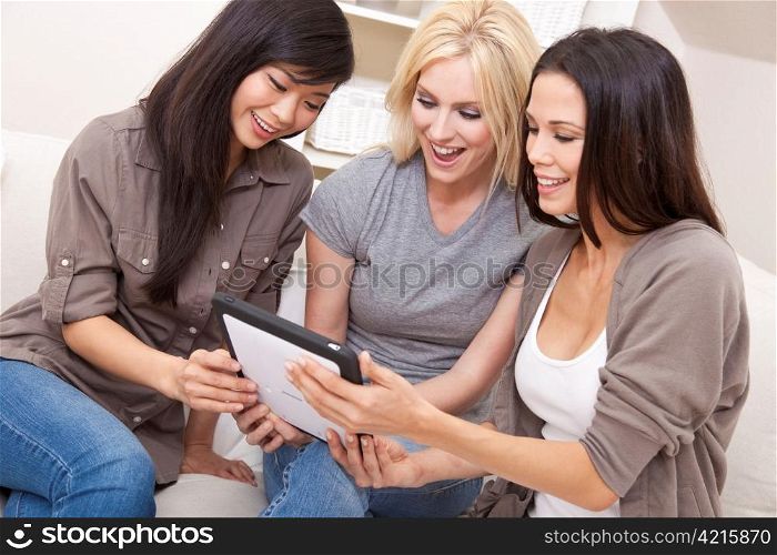 Three Beautiful Women Friends Using Tablet Computer