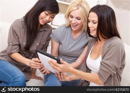 Three Beautiful Women Friends Using Tablet Computer