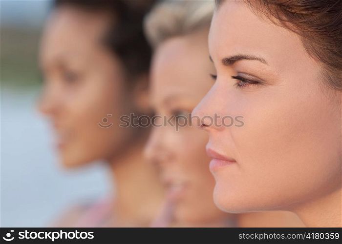 Three Beautiful Young Women In Profile