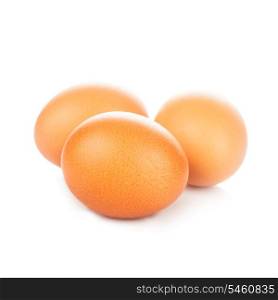Three beige chicken eggs isolated on white