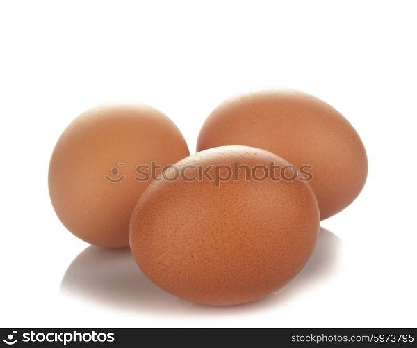 Three beige chicken eggs isolated on white. The Eggs isolated
