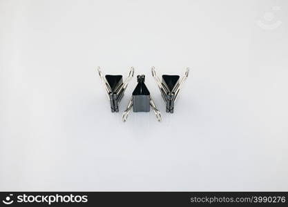Three binder clips