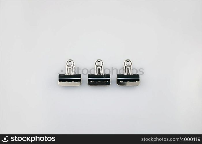 Three binder clips
