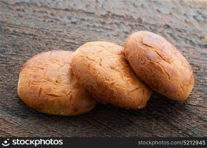 Three Biscuit Cookies On Wooden Background