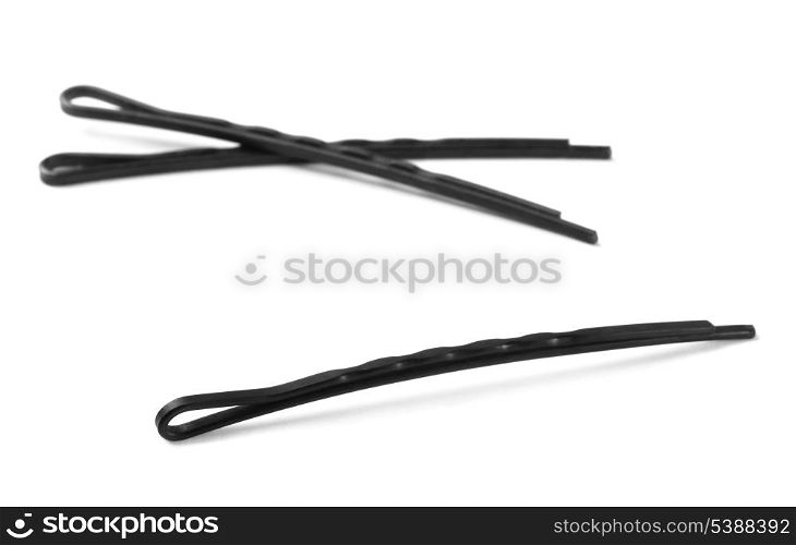 Three black metal bobby hair pins isolated on white