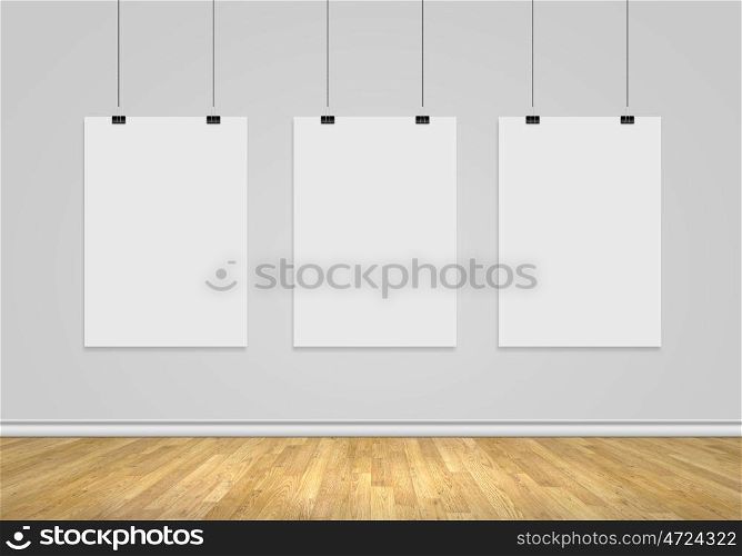 Three blank banners. Three white blank banners hanging on wall. Place for text