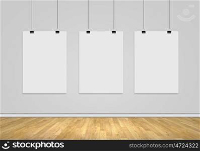 Three blank banners. Three white blank banners hanging on wall. Place for text