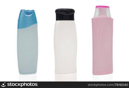 Three blank shampoo bottles on white background.