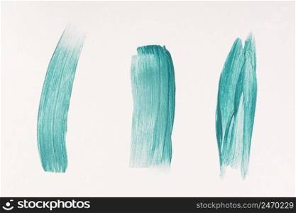 three blue paint brush strokes