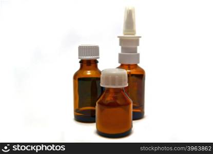 Three bottles of medication close-up on white background