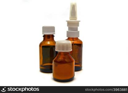 Three bottles of medication on white background