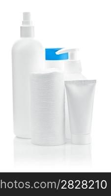 three bottles with pads and tube