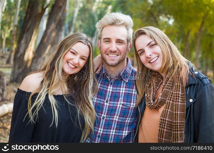 Three Brother and Sisters Portrait Outdoors.