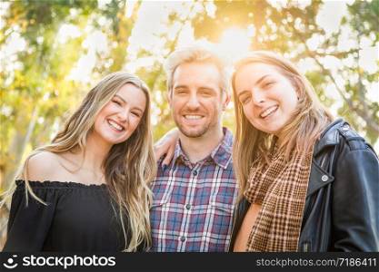 Three Brother and Sisters Portrait Outdoors.
