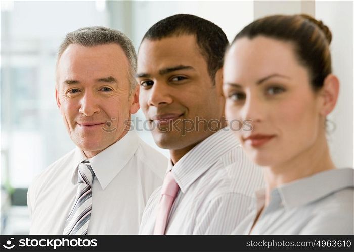 Three business colleagues in a row