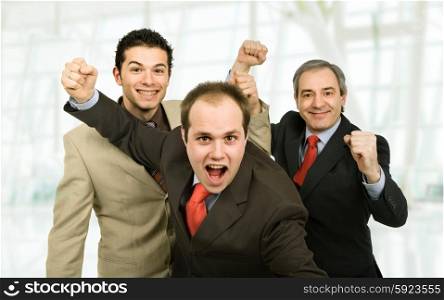 three business man at the office winning