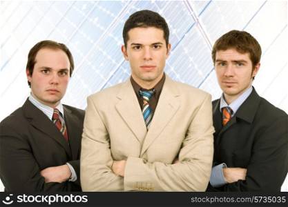 three business man standing looking at the camera