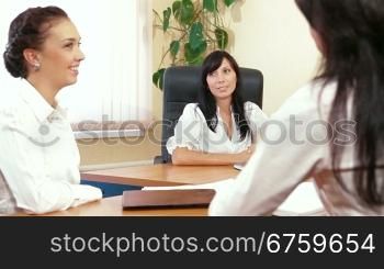 Three Business Women are Discussing in a Meeting